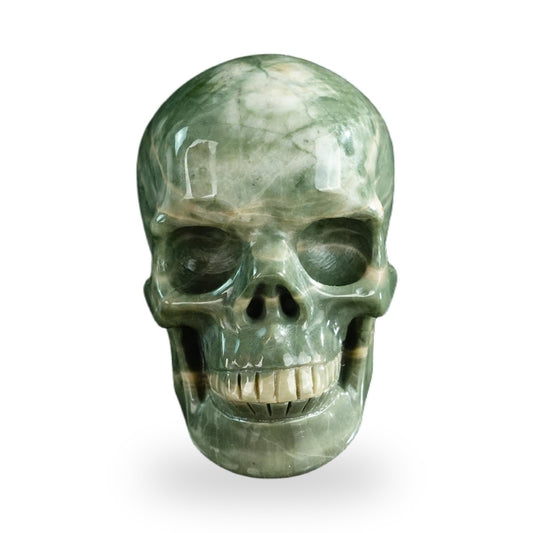 Kindred Vein 3" Nine Dragon Jade Hand Carved Crystal Realistic Skull Sculpture (SKU: SKH30HA01) - Photo 1